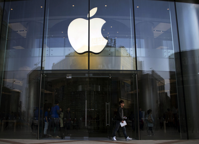 Apple is offering to pay $3.05 per share in dividends as the company prepares to pay investors for the first time. The stock price still slid 0.7 percent Tuesday.