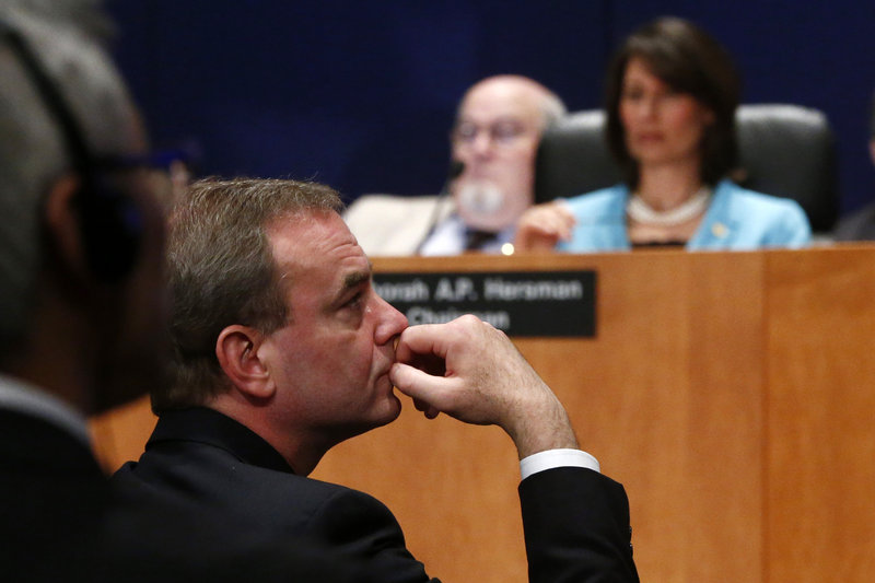 Boeing Commercial Airplanes Vice President Mike Sinnett listens during a hearing on Tuesday investigating a battery fire aboard a Boeing 787.