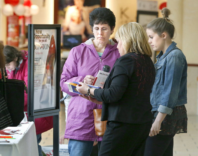 Barbara Gullbrand, left, and her daughter Bethany of Portland talk with Gail Cruikshank of Bon-Ton, which plans to open a department store at the mall in September.