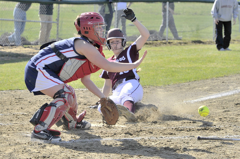 Elyse Dinan of Greely beats the ball to the plate and scores in the first inning Wednesday. The Rangers got both of their runs in the first and beat Gray-New Gloucester, 2-0. The catcher is Emily Harlow.