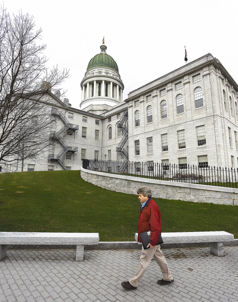 David Trahan, executive director of the Sportsman’s Alliance of Maine, walks up to the State House in Augusta for an afternoon of lobbying on gun legislation issues last Wednesday.