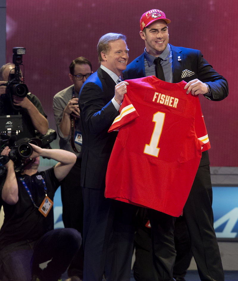 Eric Fisher, with Commissioner Roger Goodell, started the surge of lineman selections, picked at No. 1 by Kansas City.