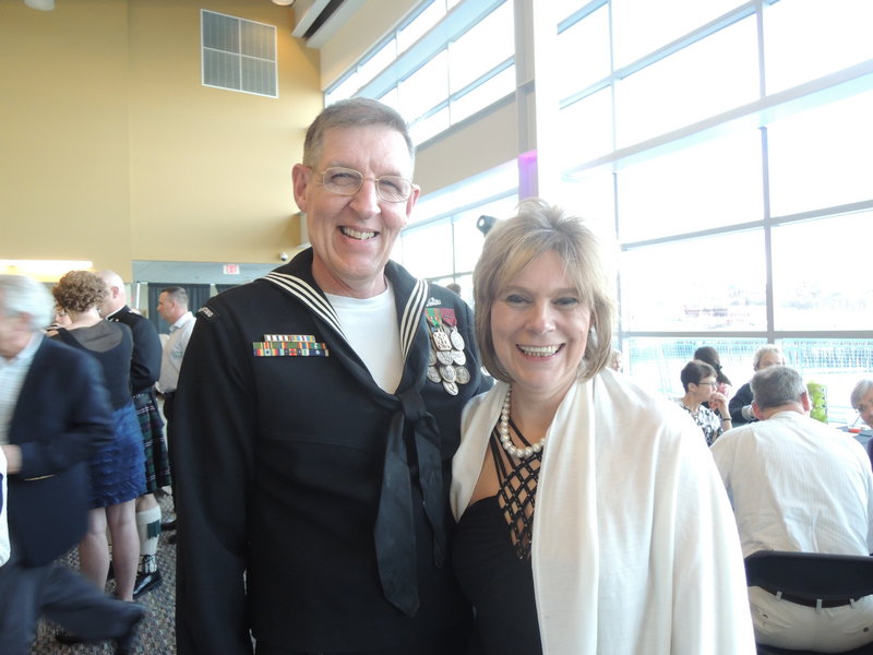 Steven and Karen Michaud at the Goodwill event. Steven, who recently retired from the Navy, attended in uniform, while Karen modeled a $21 Goodwill ensemble in the Goodwill finds fashion show.