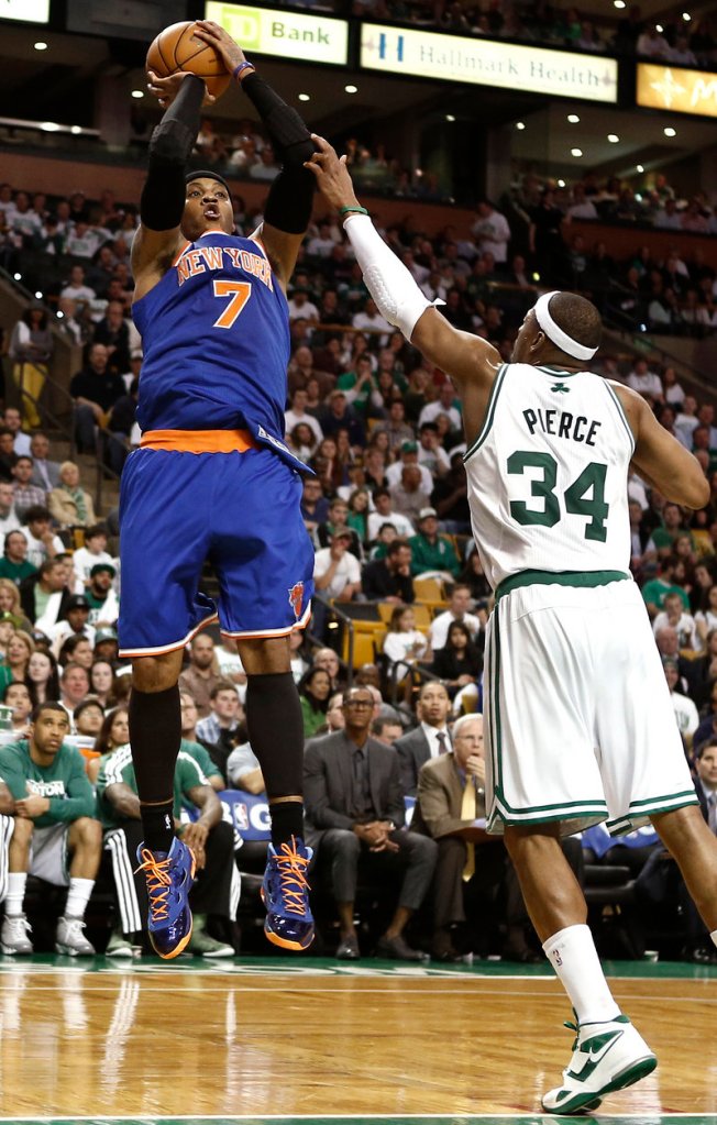 Carmelo Anthony of the Knicks shoots over Paul Pierce during New York’s 90-76 victory Friday night in Boston. The Knicks can complete a sweep of the first-round series on Sunday.