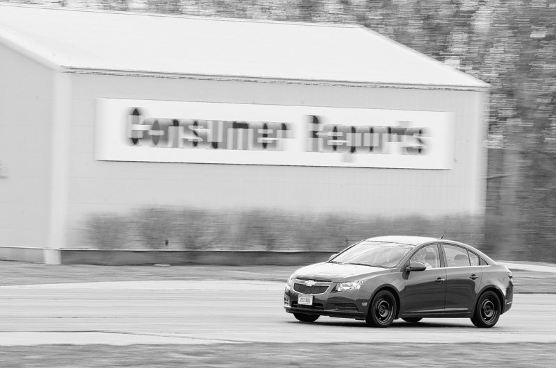 Ryan Pszczolkowski, engineer at Consumer Reports automotive testing center in East Haddam, Conn., runs a Chevy Cruz over the handling track during a tire test.