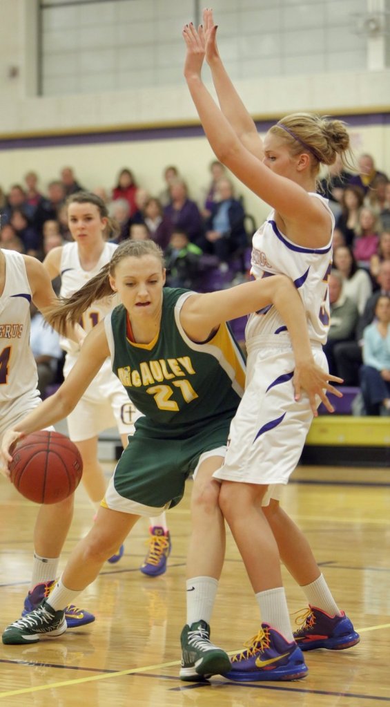 Olivia Smith of Portland’s McAuley High School drives in a game against Cheverus on Jan. 15.