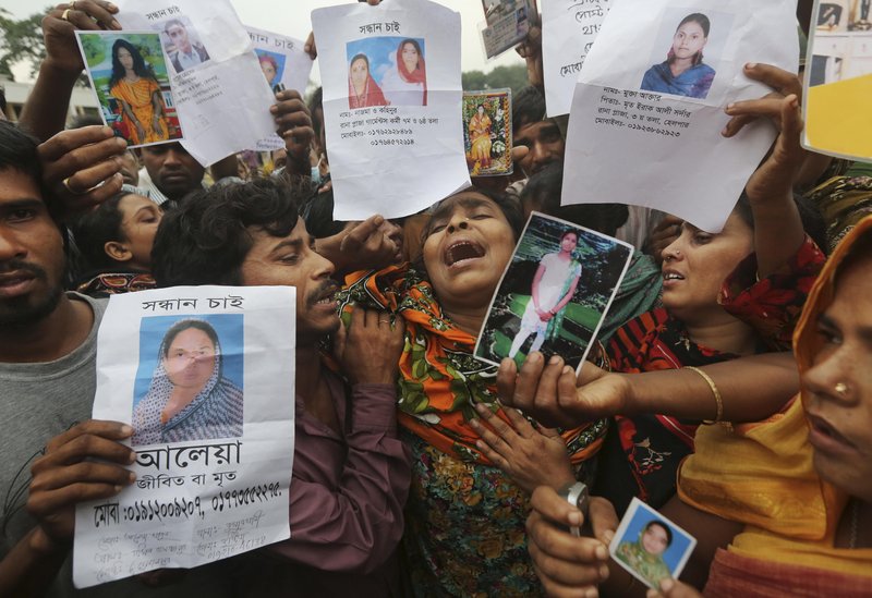 Relatives of Bangladeshi garment worker Mohammed Abdullah openly grieve.
