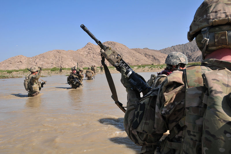U.S. soldiers cross the Tarnak River in Kandahar province, Afghanistan, earlier this month. April has already been the worst month for combat deaths so far this year, with 474 people killed in violence around the nation.