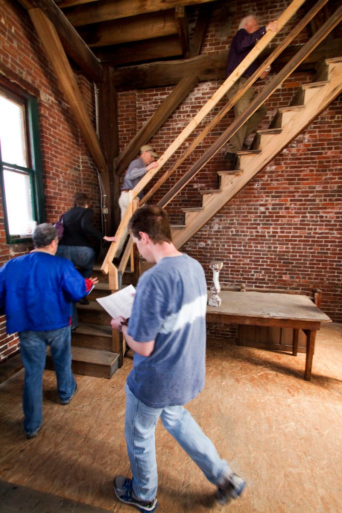 People tour the Biddeford City Hall clock tower during an event Saturday.