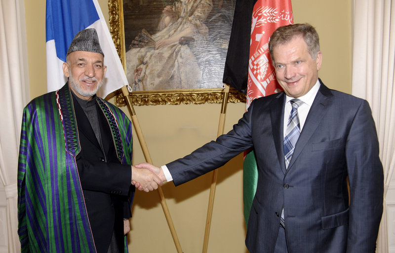Hamid Karzai, left