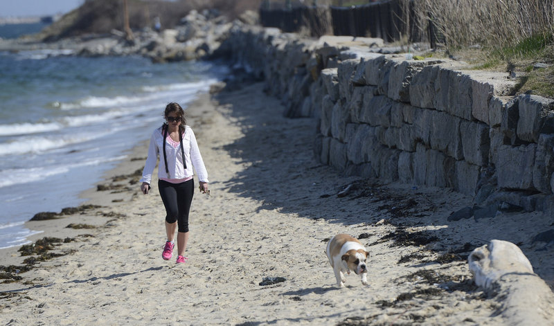 Chanel Bastille of Portland walks with her dog Coco, a bulldog, at East End Beach in Portland Monday, April 29, 2012.