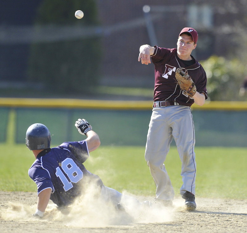 Second baseman Dan Burke of Freeport fires to first Monday after forcing Alex Mercurio of York in the third inning. The Falcons were unable to complete the double play. York won the Western Maine Conference game, 5-3.