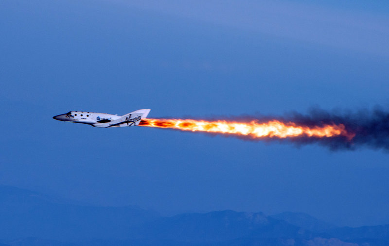 SpaceShipTwo flies under rocket power over the Mojave Desert on Monday, in this photo provided by Virgin Galactic. The spaceship is bankrolled by British tycoon Sir Richard Branson and an Abu Dhabi investment company.