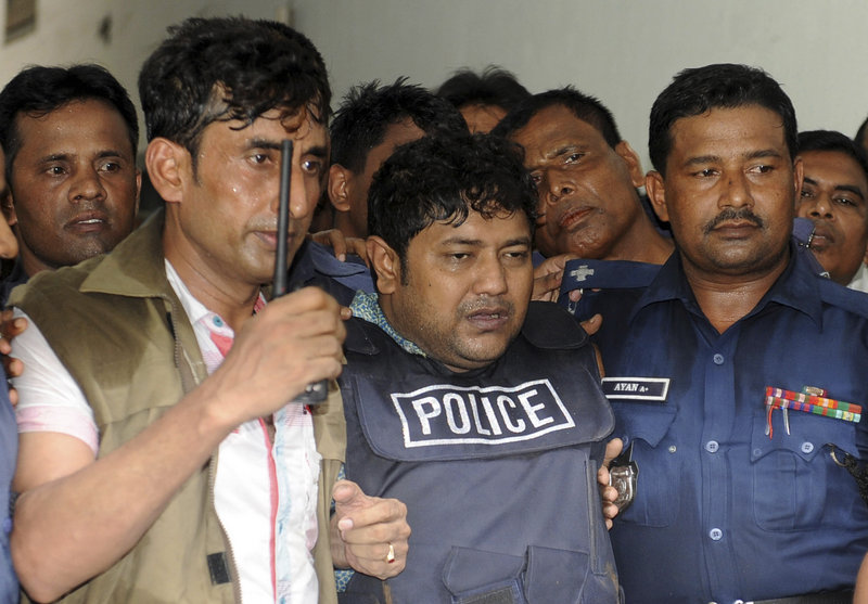 Mohammed Sohel Rana, center, owner of the collapsed building is brought to a court in Dhaka, Bangladesh, Monday.