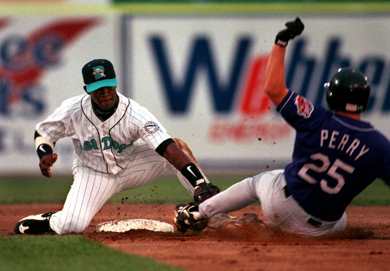 STAFF PHOTO BY GORDON CHIBROSKI -- Monday, August 11, 1997 -- Seadogs' 2nd baseman, Ralph Milliard, puts the tag on Chan Perry of the Akron Aeros as he tried to stretch a single into a double. Action in second inning at Hadlock Field in Portland. Gordon Chibroski