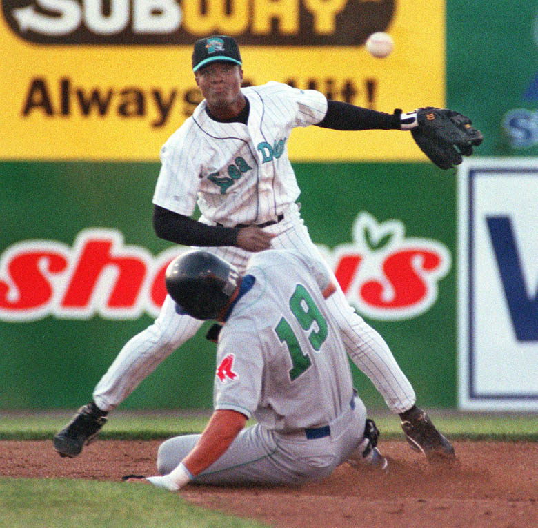 Staff Photo by David MacDonald, Mon, Jun 19, 2000: Sea Dogs' 2nd baseman Pablo Ozuna makes the relay to 1st over a sliding Virgil Chevalier of the Trenton Thunder to complete a 3rd inning double play. David MacDonald Pablo Ozuna sea dogs Virgil Chevalier baseball