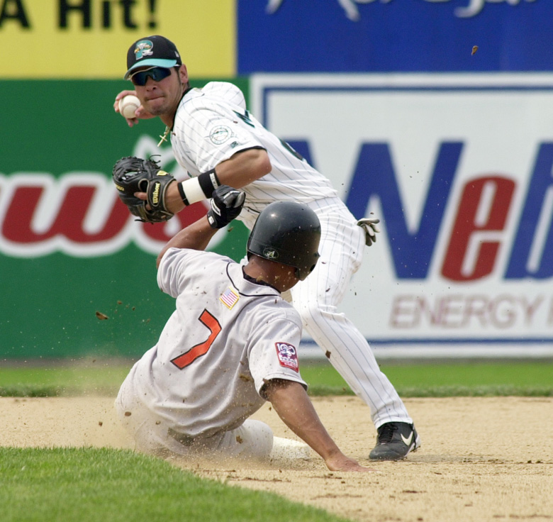 Staff Photo by Jack Milton, Thu, Jul 18, 2002: Sea Dogs #21, Jesus Medrano turns a double play in the 7th inning despite the best efforts of Erie Sea Wolves #7, Jhonny Perez. Jack Milton Jesus Medrano Sea Dogs baseball Jhonny Perez