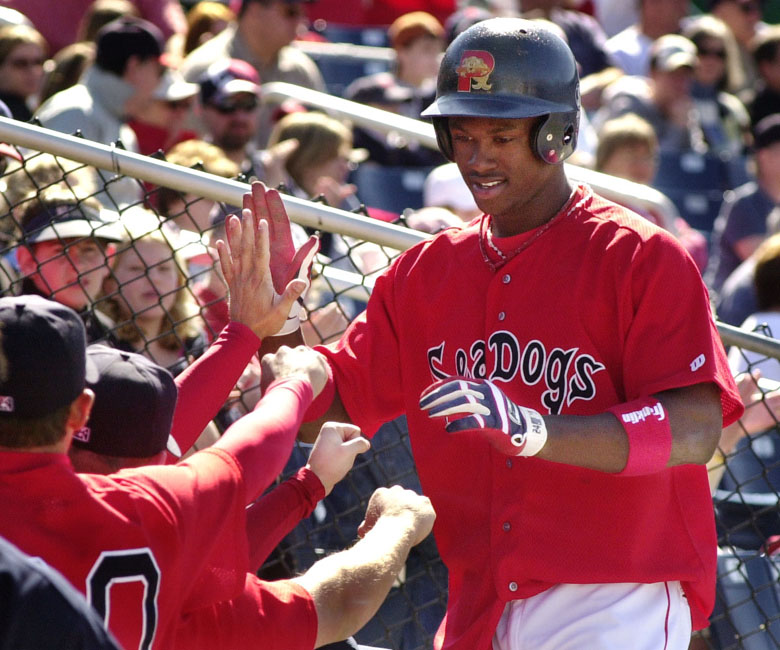 Staff Photo by Jill Brady, Sunday, April 10, 2005: Portland Sea Dog Hanley Ramirez is greeted by his teammates after scoring in the bottom of the eighth inning Sunday during baseball action against the Norwich Navigators at Hadlock Field. Baseball Jill Brady