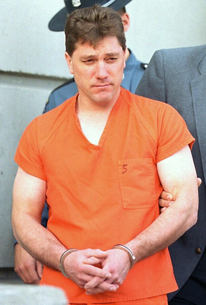 Jeffrey Cookson is led from the Penobscot County Jail in Bangor in December 1999. 