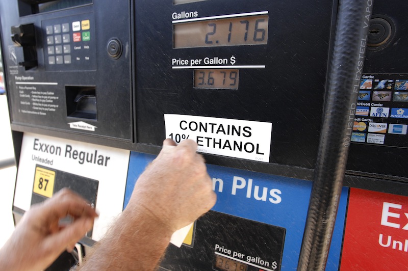 In this 2008 file photo, Brian McLaughlin, a field safety technician for Dead River Co., attaches an E-10 label on a gas dispenser at a Dead River Exxon station in Biddeford. In an initial vote Wednesday, May 15, 2013, the Maine Senate rejected a bill that could eventually ban the use of ethanol in motor fuel sold in the state.