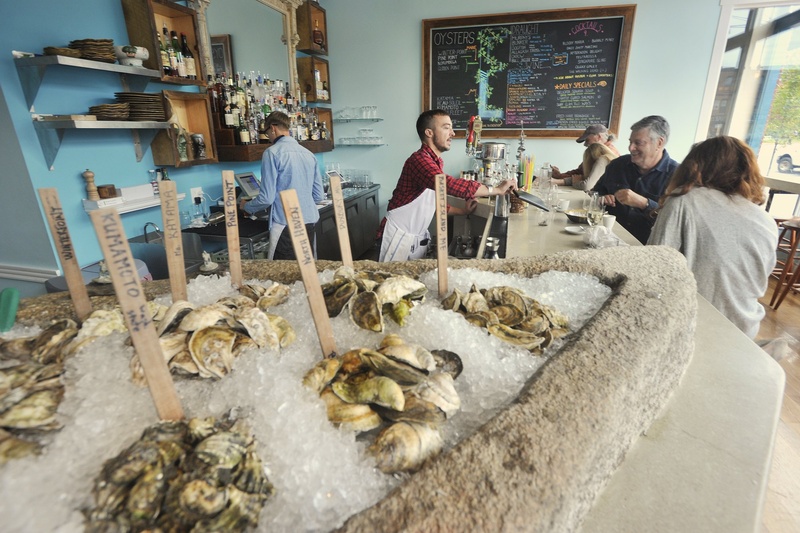 Eventide Oyster Co. at 86 Middle St. in Portland "combines foods from Maine and 'from away' in dazzling mash-ups."