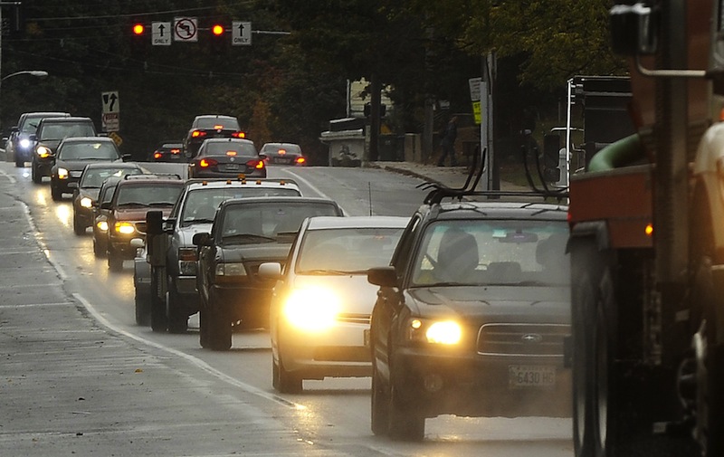 This October 2012 file photo shows heavy traffic on Broadway in South Portland. Predictions of rain every day but Monday, and cool temperatures too, could put a damper on Memorial Day travel this weekend.