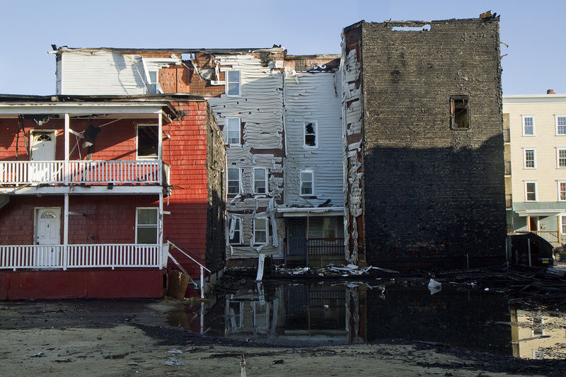 Buildings show damage in the immediate aftermath of the fire at Bartlett and Pierce streets in Lewiston on May 3.