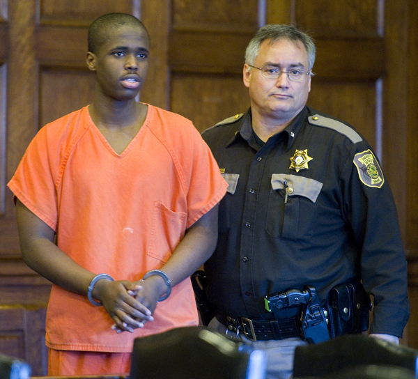 Mohammed Mukhtar arrives in court escorted by a Cumberland County sheriff's deputy.
