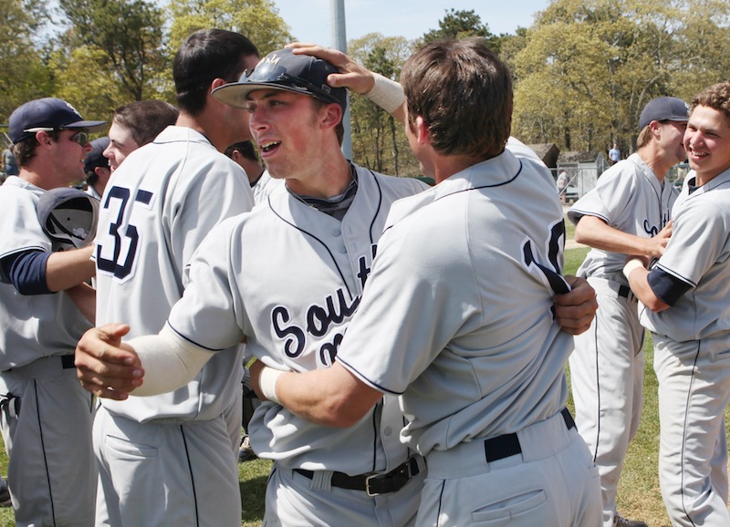 University of Southern Maine's Nick Grady, left, and Troy Thibodeau, right, celebrate their victory over Endicott College Sunday May, 19, 2013 following the championship game of the NCAA Division III New England Regional in Harwich, Mass. USM beat Endicott 9 to 0.