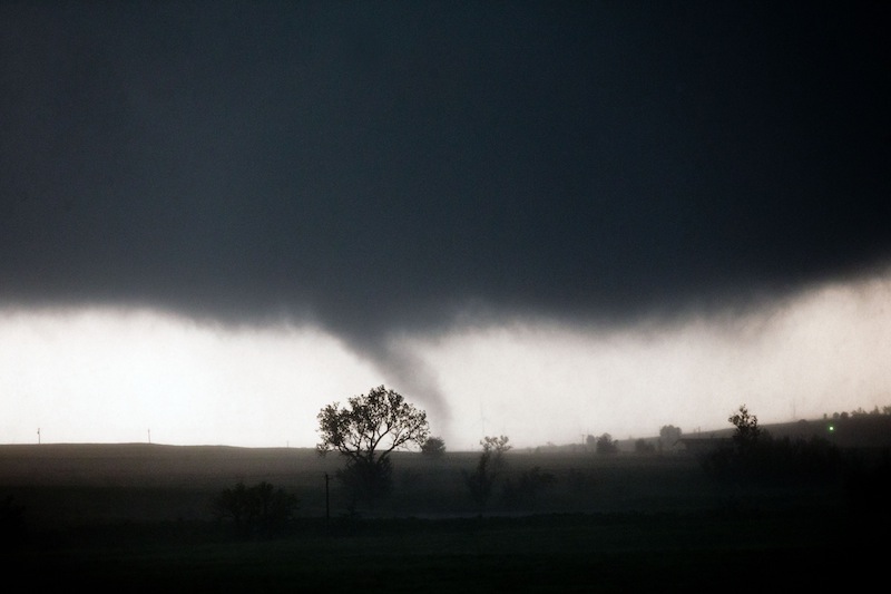 A tornado touches down near El Reno, Okla., Friday, May 31, 2013, causing damage to structures and injuring travelers on Interstate 40. I-40 has been closed after severe weather rolled through the area. (AP Photo/Omaha World-Herald, Chris Machian)