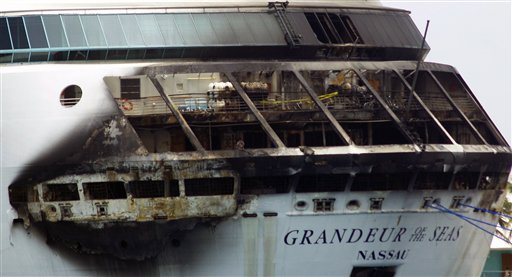 Multi-story damage is evident as Royal Caribbean’s Grandeur of the Seas is docked in Freeport, Bahamas, Monday. Royal Caribbean said the fire occurred early Monday. The U.S. Coast Guard and National Transportation Safety Board are investigating.