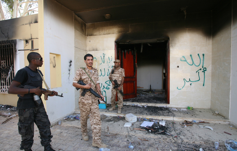 Libyan military guards check one of the U.S. Consulate's burned-out buildings after a deadly attack there in Benghazi, Libya.