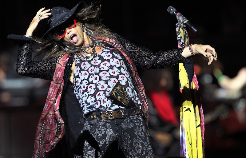 This May 25, 2013 file photo shows Steven Tyler, lead singer of American rock band Aerosmith performing in Singapore during the inaugural Social Star Awards concert. Aerosmith, James Taylor and Jimmy Buffett were among many artists who performed at the Boston Strong Concert: An Evening of Support and Celebration at the TD Garden on Thursday, May 30, 2013 in Boston. (AP Photo/Wong Maye-E, file)