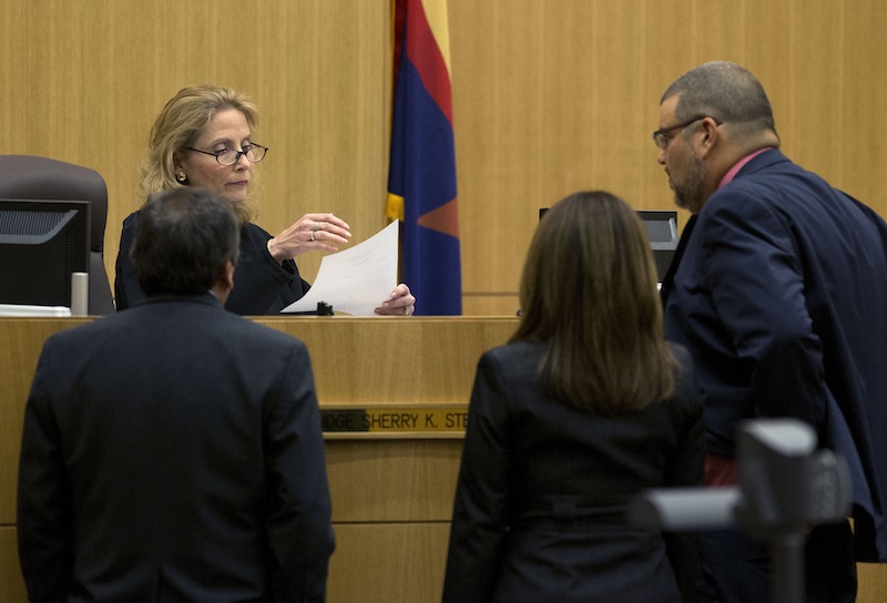 Judge Sherry Stephens looks at a question from the jury with prosecutor Juan Martinez, left, and defense attorneys Jennifer Wilmott and Kirk Nurmi, right, on Wednesday, May 22, 2013 during the penalty phase of the Jodi Arias murder trial at Maricopa County Superior Court in Phoenix . Arias was convicted of first-degree murder in the stabbing and shooting to death of Travis Alexander. (AP Photo/The Arizona Republic, Rob Schumacher, Pool)