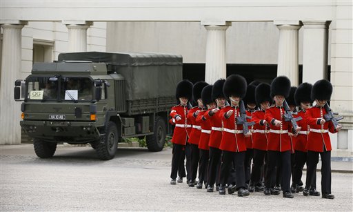 British soldiers march at Wellington Barracks in London on Thursday as new information emerged about the butchering of a British soldier near an army barracks in Woolwich by suspected Islamic radicals.