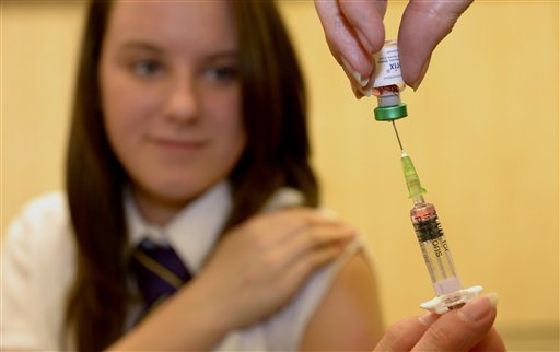 Lucy Butler,15, gets ready to have her measles jab recently at All Saints School in Ingleby Barwick, Teesside, England, during a national vaccination catch-up campaign to curb a rise in measles cases in England.