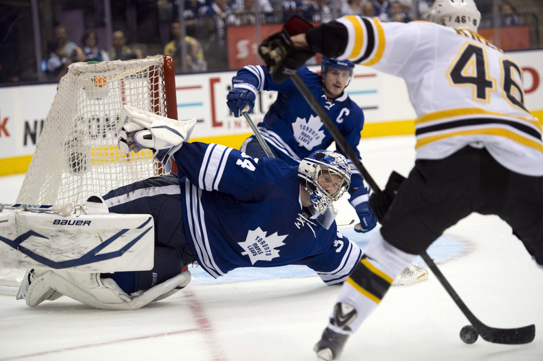 Toronto Maple Leafs goaltender James Reimer makes a diving save on Boston Bruins' David Krejci during the third period of Game 4 of their NHL Stanley Cup playoff series Wednesday in Toronto.