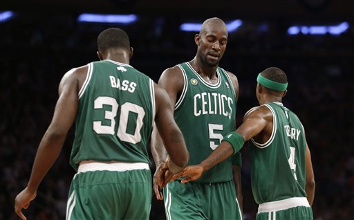 Boston Celtics forward Brandon Bass, Celtics center Kevin Garnett (5) and Celtics guard Jason Terry (4) react to a play in Game 5 of the first-round playoff series against the Knicks. The Celtics went on to idefeat the Knicks 92-86.