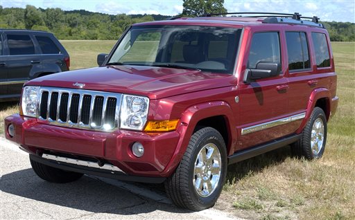 A 2006 Jeep Commander sits on display at Chelsea Proving Grounds in Chelsea, Mich. Chrysler is recalling 469,000 Jeep SUVs worldwide because they can shift into neutral without warning, the company announced Saturday.