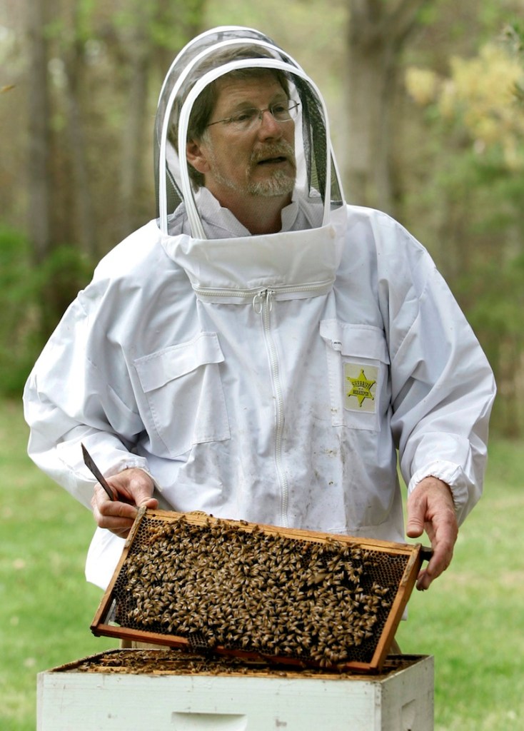 In this April 25, 2007 file photo, Jeffery Pettis, a top bee scientist at the Agriculture Department's Bee Research Laboratory, talks about his work with honeybees, in Beltsville, Md. A new federal report blames a combination of problems for a mysterious and dramatic disappearance of U.S. honeybees since 2006. The factors cited include a parasitic mite, multiple viruses, bacteria, poor nutrition and pesticides. Experts say having so many causes makes it harder to do something about what's called colony collapse disorder. The disorder has caused as much as one-third of the nation's bees to just disappear over the winter each year since 2006. The report was issued Thursday by the Agriculture Department and the Environmental Protection Agency. (AP Photo/Haraz N. Ghanbari, File)