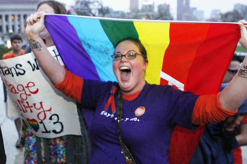 Rachel Ford cheers during a rally supporting a same-sex marriage bill in Minnesota on the steps of the State Capitol in St. Paul, Minn., on Wednesday May 8, 2013. The Minnesota House is scheduled to debate and vote Thursday on a measure that would make the state the 12th in the country to allow gay marriage. (AP Photo/Andy Clayton King)