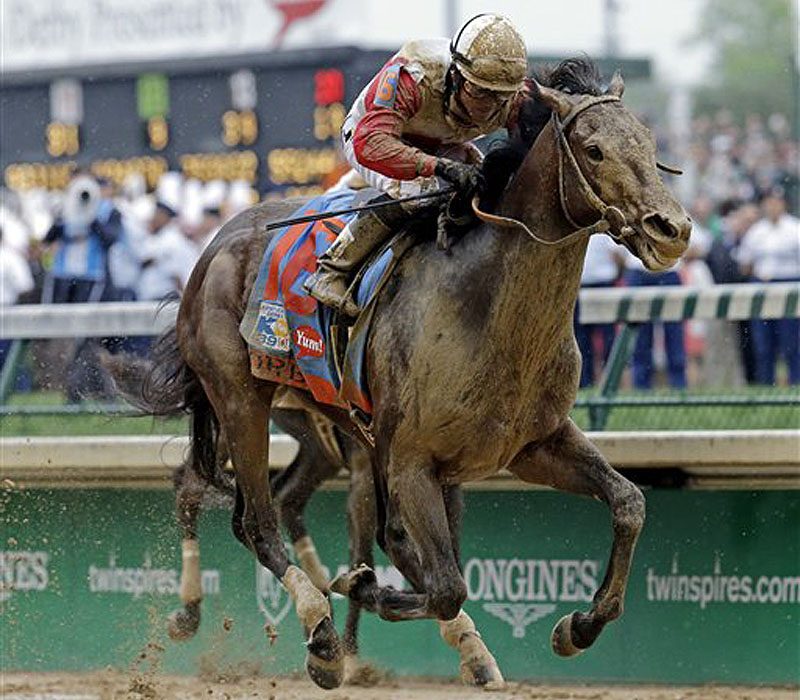 Joel Rosario spurs Orb, the 5-1 favorite, down the stretch Saturday to win the Kentucky Derby by 2 1⁄2 lengths for Shug McGaughey, the Hall of Fame trainer.