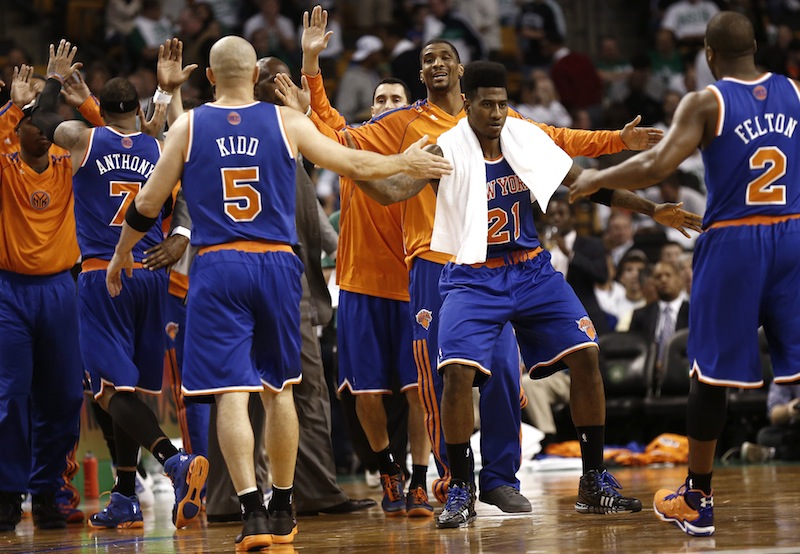 New York Knicks' Carmelo Anthony (7), Jason Kidd (5) and Raymond Felton (2) are congratulated by teammates including Iman Shumpert (21) while leaving the court during the fourth quarter of New York's 90-76 win over the Boston Celtics in Game 3 of a first round NBA basketball playoff series in Boston Friday, April 26, 2013. (AP Photo/Winslow Townson)