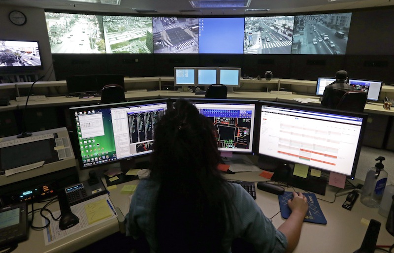 This Wednesday, April 24, 2013 photo shows transportation engineer associate Abeer Kliefe working at the Los Angeles Department of Transportation's Automated Traffic Surveillance and Control Center in downtown Los Angeles. In small towns and big cities, police and politicians are pointing to the surveillance video that was key to identifying the Boston Marathon bombing suspects as a reason to bolster their own networks and get more electronic eyes on their streets. In Los Angeles, a councilman wants police to broaden their network by giving them access to traffic cameras used to monitor the flow of cars on the road. (AP Photo/Reed Saxon)