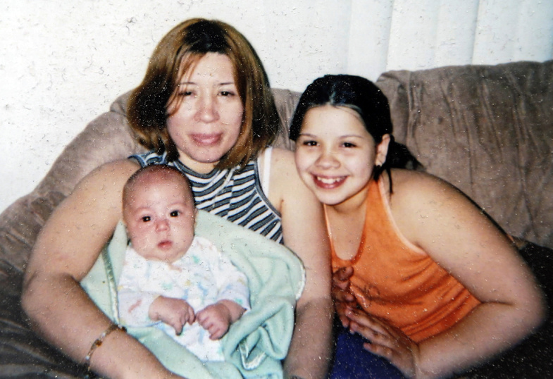 In this undated photo provided by Elida Caraballo, her sister, Grimilda Figueroa, is shown with two of her children, Ryan, left, and Rosie. Figueroa, who died last year, was the common law wife of Ariel Castro, accused of kidnapping and holding three women captive for a decade in his Cleveland home.