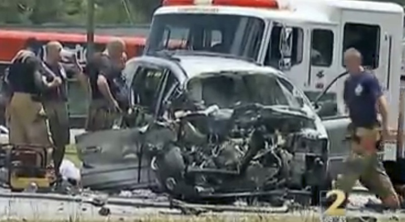 In this image taken from video, emergency personnel work the scene of a car crash Friday, May 31, 2013, in Jonesboro, Ga. Former NBA All-Star guard Daron "Mookie" Blaylock was on life support at a hospital Friday after his SUV crossed the center line and crashed head-on into a van in suburban Atlanta, police said. Clayton County (Ga.) police spokesman Clarence Cox says the man and woman riding in the van were also injured and to the hospital. Their names and conditions were not immediately available. (AP Photo/WSB-TV) MANDATORY CREDIT