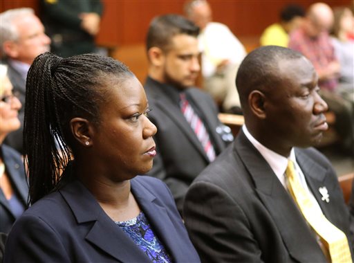 Sybrina Fulton, the mother shooting victim Trayvon Martin, sits with with her attorney Benjamin Crump, during a pretrial hearing on Tuesday for George Zimmerman, the accused shooter of Trayvon Martin.