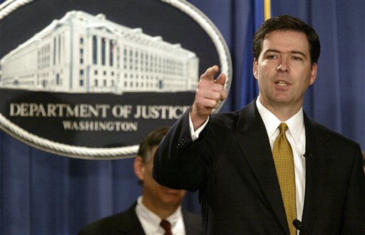 In this Jan. 14, 2004, photo, then-Deputy Attorney General James Comey answers questions during a news conference in Washington.