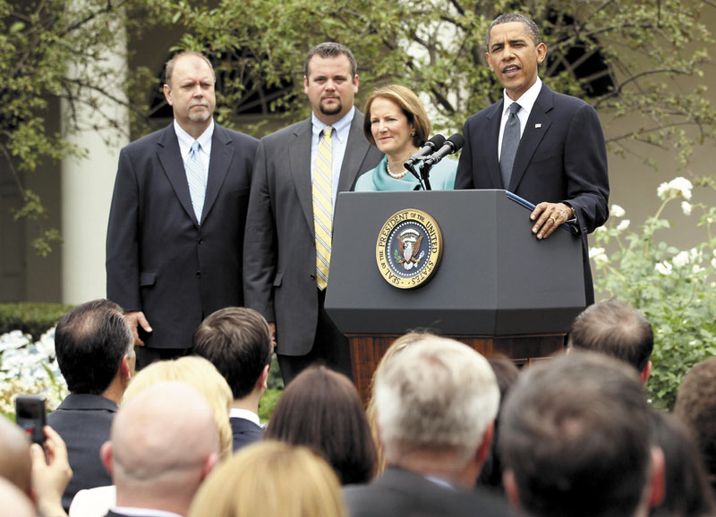 President Barack Obama stands with, from left, small business owners Tom Sturtevant and Trapper Clark of ALCOM Inc., of Winslow, and Small Business Administration Administrator Karen Mills, in the Rose Garden of the White House in Washington, on May 25, 2010, as he addressed small business owners about the economy.