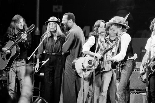 In this December 1975 photo, musicians Roger McGuinn, Joni Mitchell, Richie Havens, Joan Baez and Bob Dylan perform the finale of the The Rolling Thunder Revue, a tour headed by Dylan.